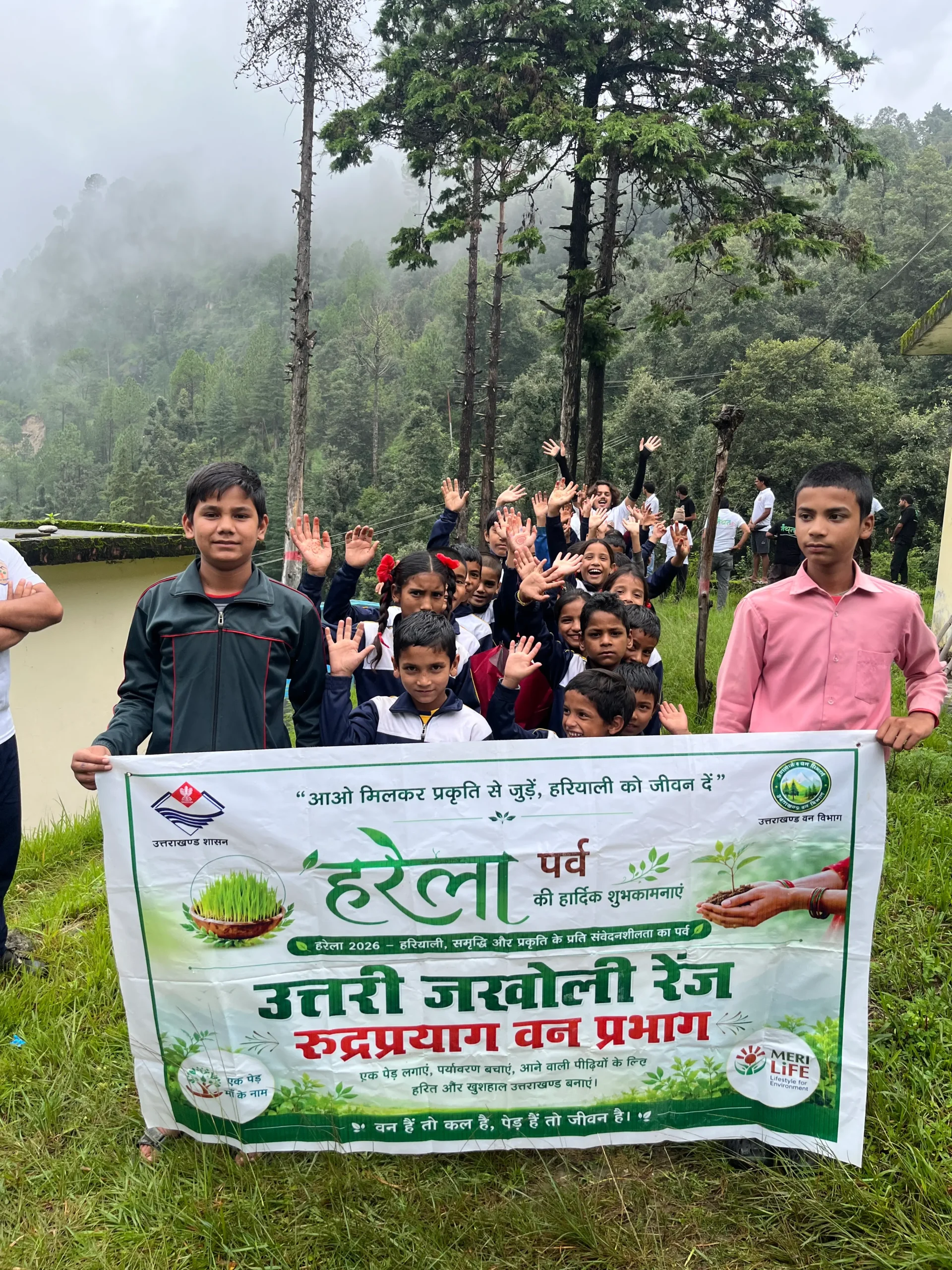 Village residents and children participating in a community environmental activity in Bangar Valley