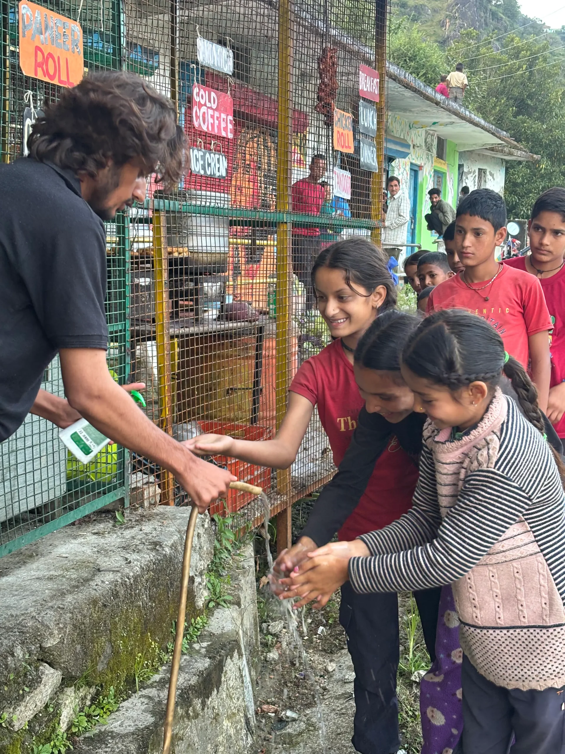Community members participating in the cleanliness activity